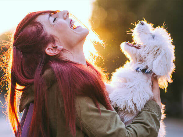 photo of woman with dog