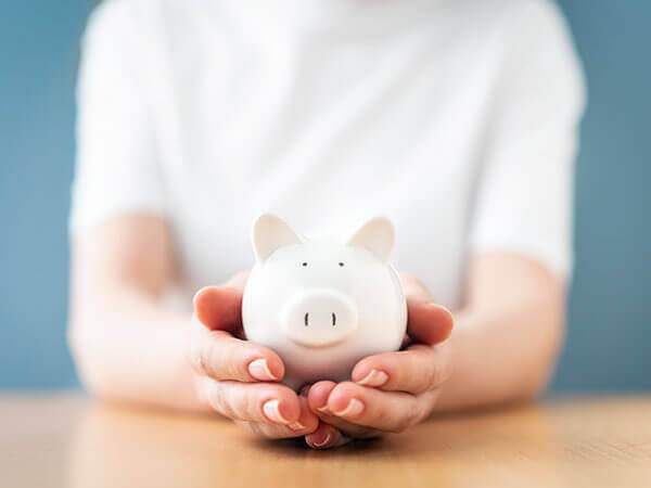 person holding piggy bank