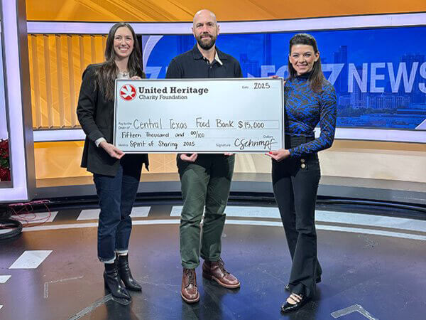 Check presentation at FOX 7 with the Central Texas Food Bank and UHCU's AVP of Marketing.