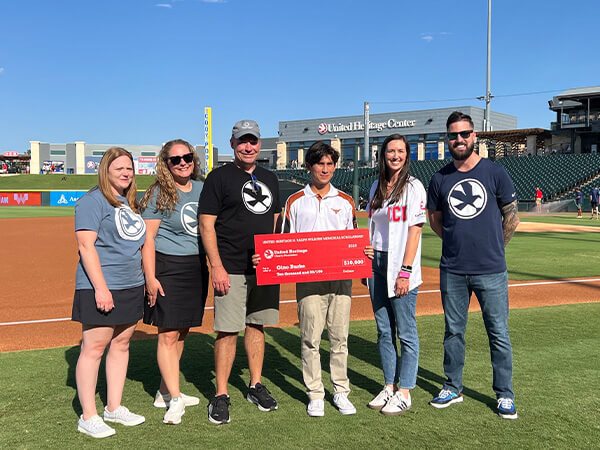 Gino Burke and board members of UHCF at Dell Diamond