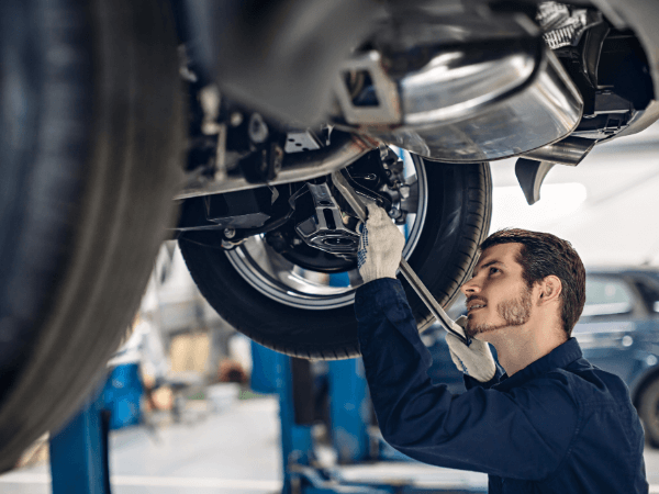 Man repairing vehicle