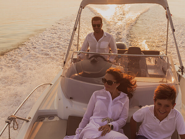 Family inside small yacht on a lake