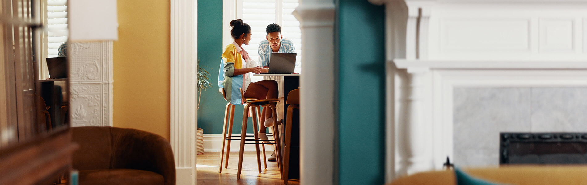 Young couple planning for their first home purchase with UHCU.