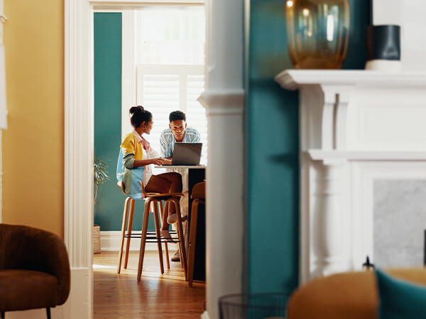 Young couple planning for their first home purchase with UHCU.