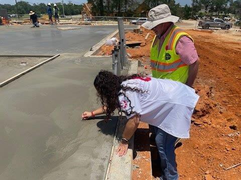 Employees signing the slab