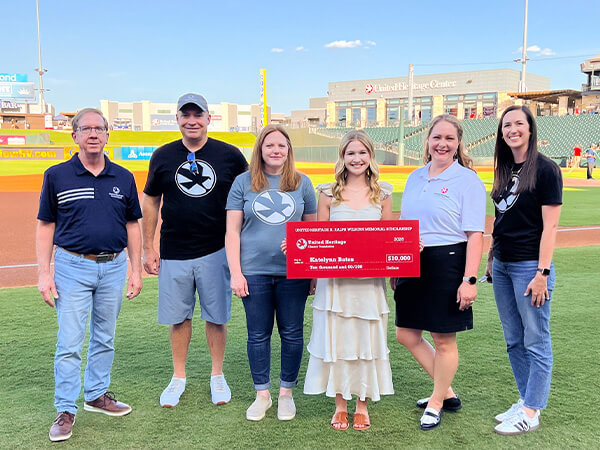 Katelynn Bates and board members of UHCF and UHCU CEO at Dell Diamond