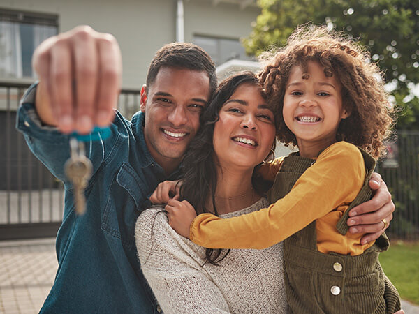 Family standing outside of new home